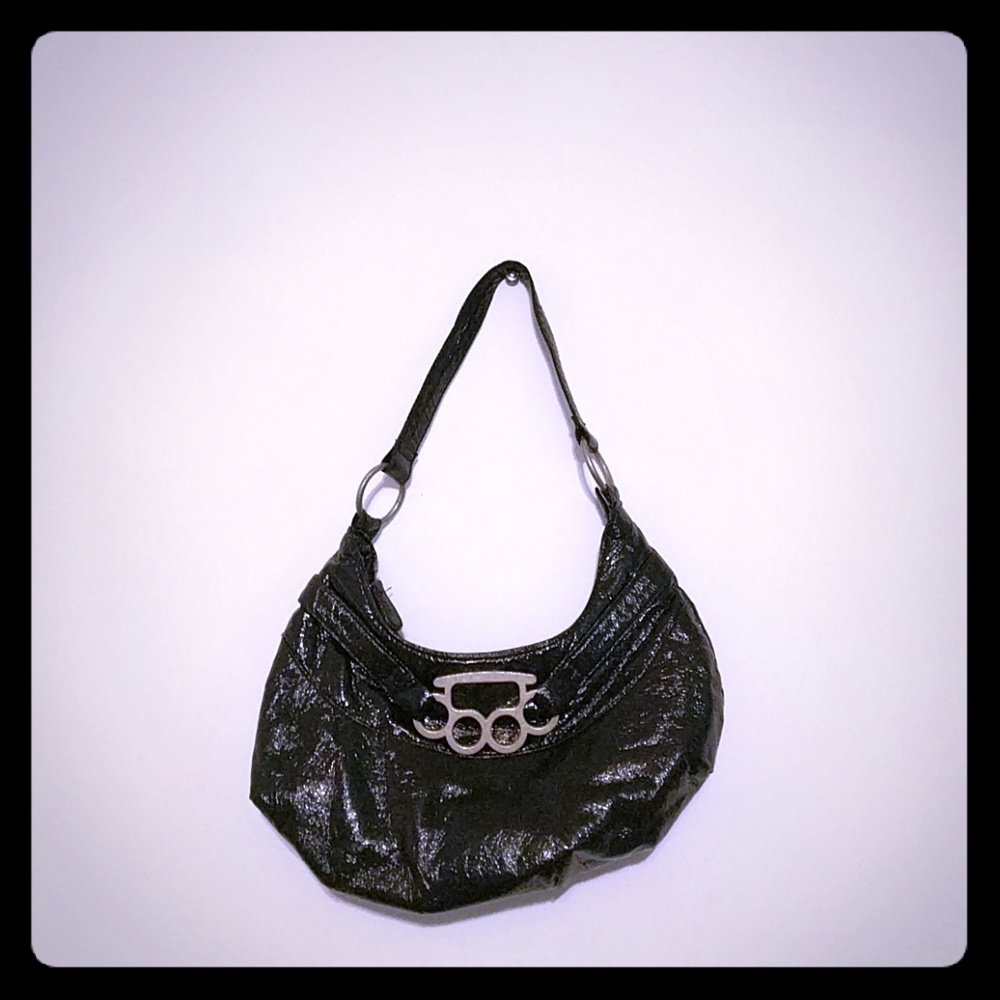 Brass knuckle handbag